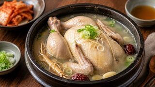 Samgyetang with whole young chicken, sticky rice, ginseng, garlic, jujubes and spring onions