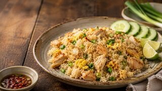 Thai Khao Pad Gai with fried jasmine rice, chicken, egg, spring onion, cucumber and lime